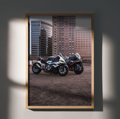 BMW M1000RR and S1000RR drag spec motorcycles poster wall art with urban backdrop in wooden frame.