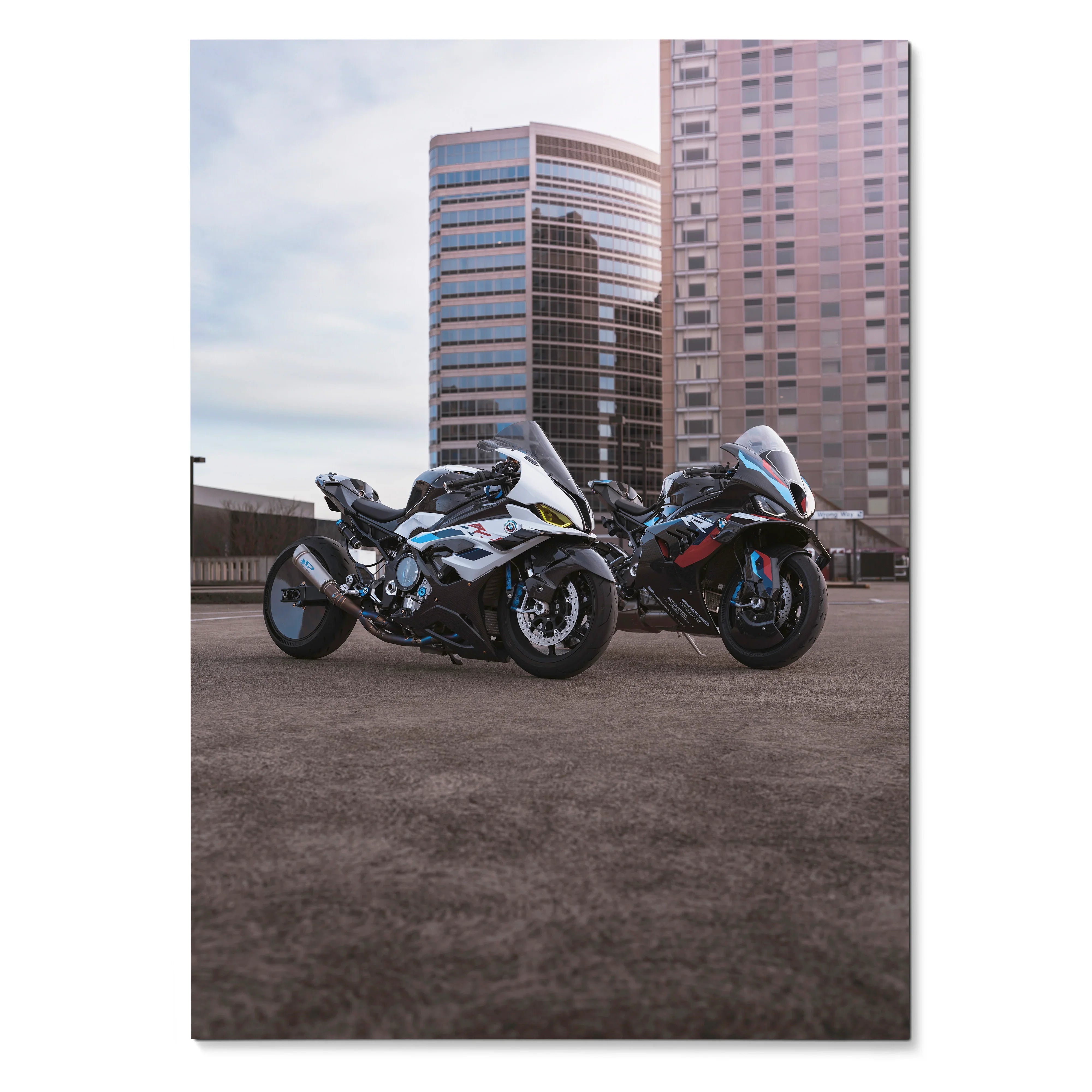 BMW M1000RR and S1000RR Drag Spec motorcycles parked with city skyscrapers in the background poster wall art.