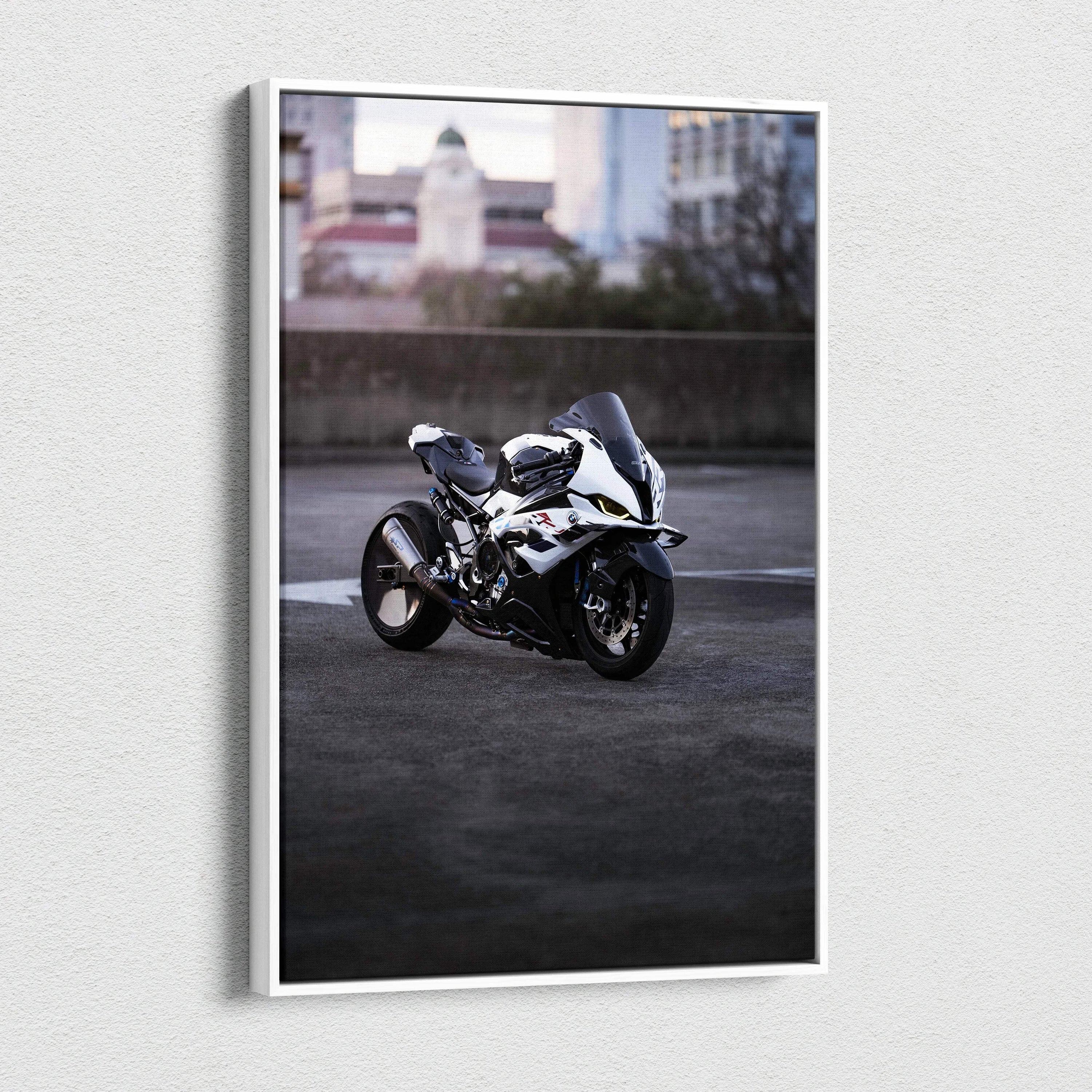 Vertical canvas art featuring a white BMW S1000RR motorcycle parked on urban pavement at dusk.