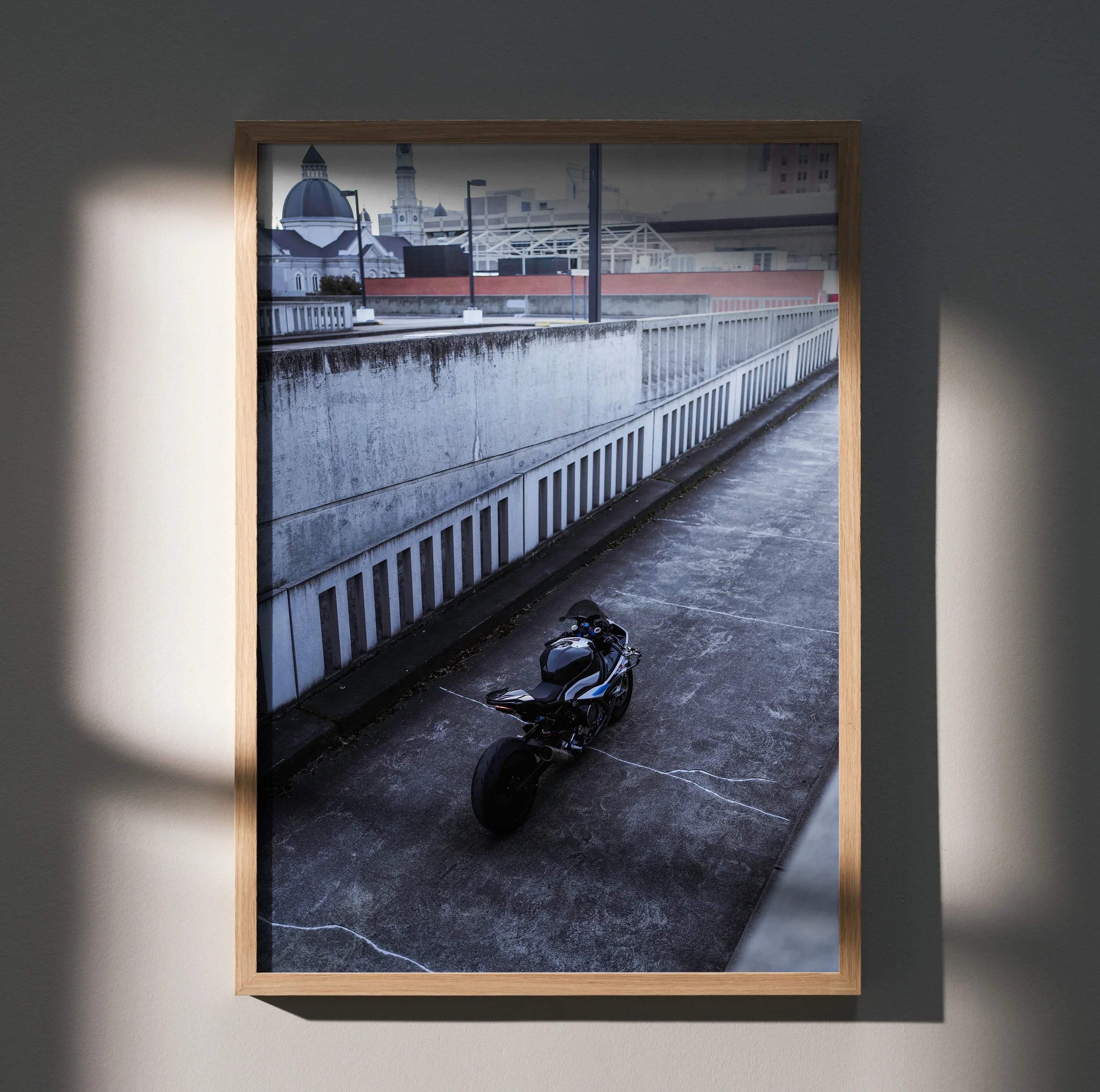 BMW S1000RR motorcycle parked in urban setting poster wall art with modern frame.