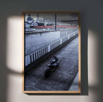 BMW S1000RR motorcycle parked in urban setting poster wall art with modern frame.
