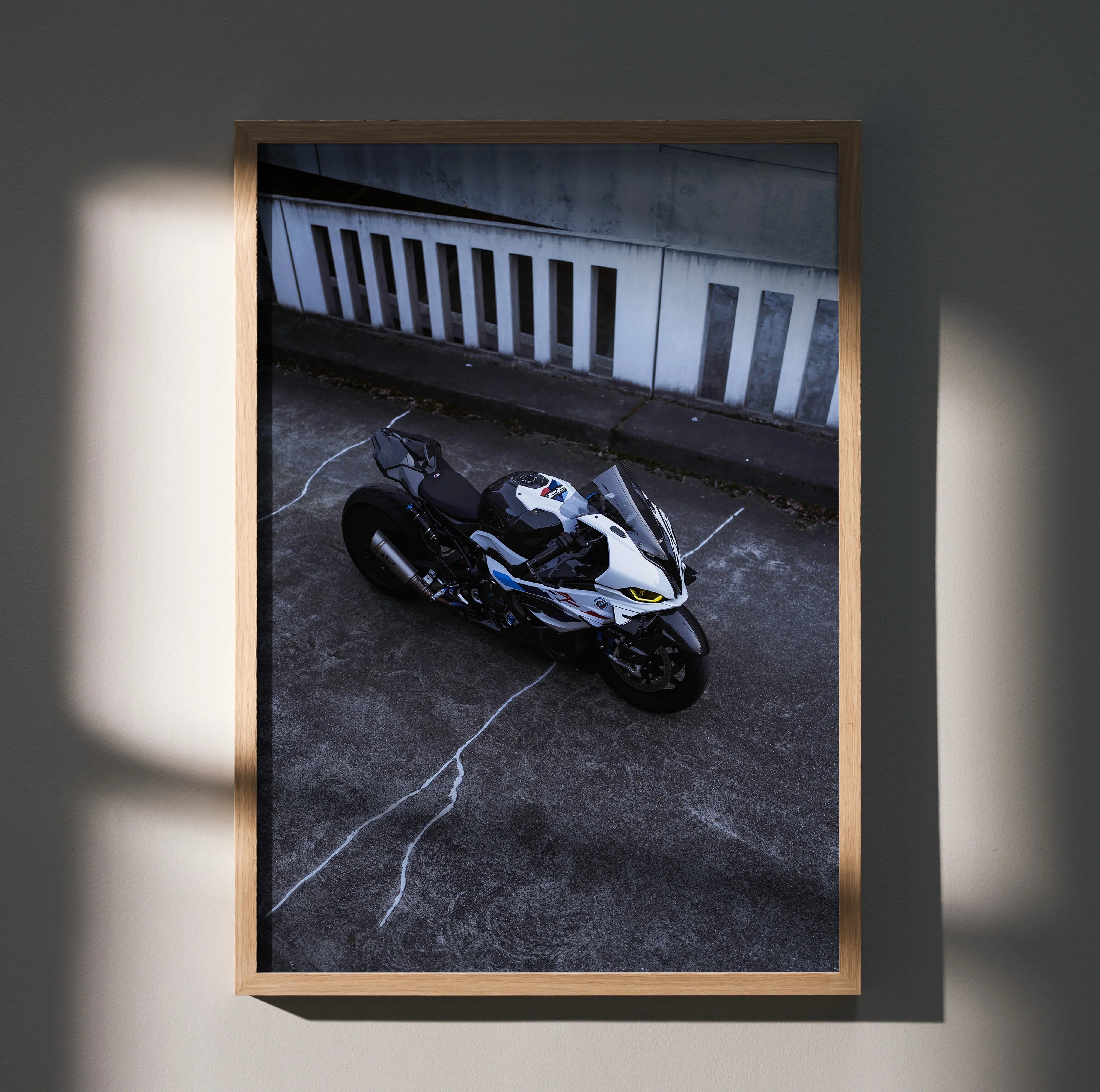 BMW S1000RR Drag Spec motorcycle wall art poster in black, white, and blue tones with dynamic urban background.