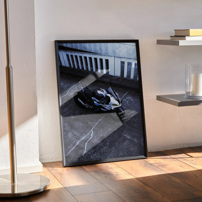 BMW S1000RR 011 Drag Spec motorcycle poster wall art with black frame leaning on floor.