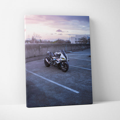 BMW S1000RR motorcycle in parking lot at sunset canvas wall art vertical print.