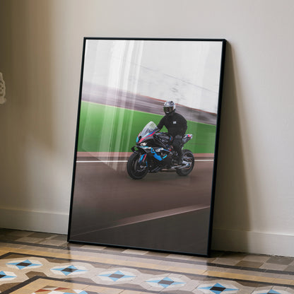 BMW M1000RR motorcycle racing on track poster leaning on wall, vibrant wall art.