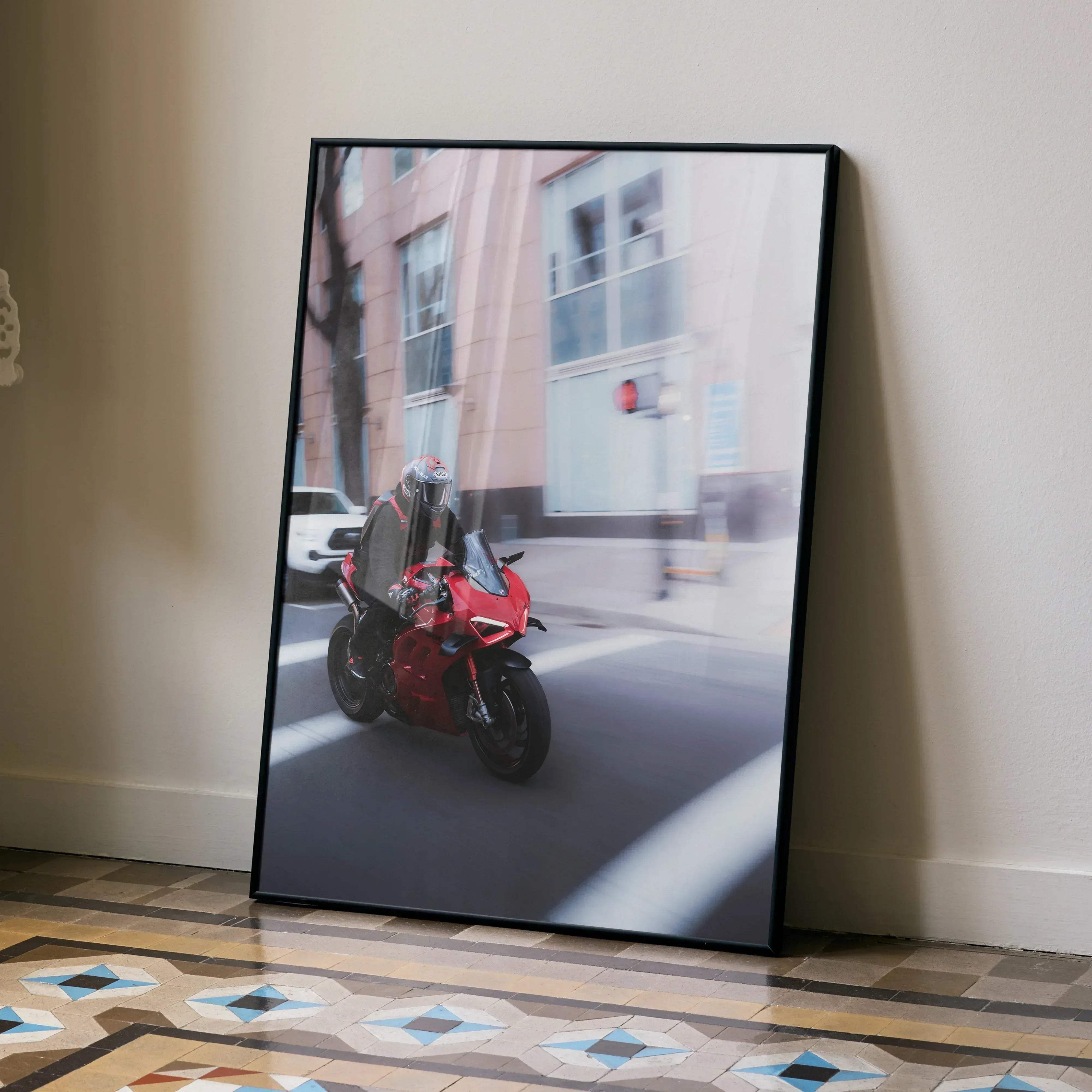 Biker poster 043 featuring red ducati v4s motorcycle rolling shot in a sleek black frame with male shoai x14 helmet