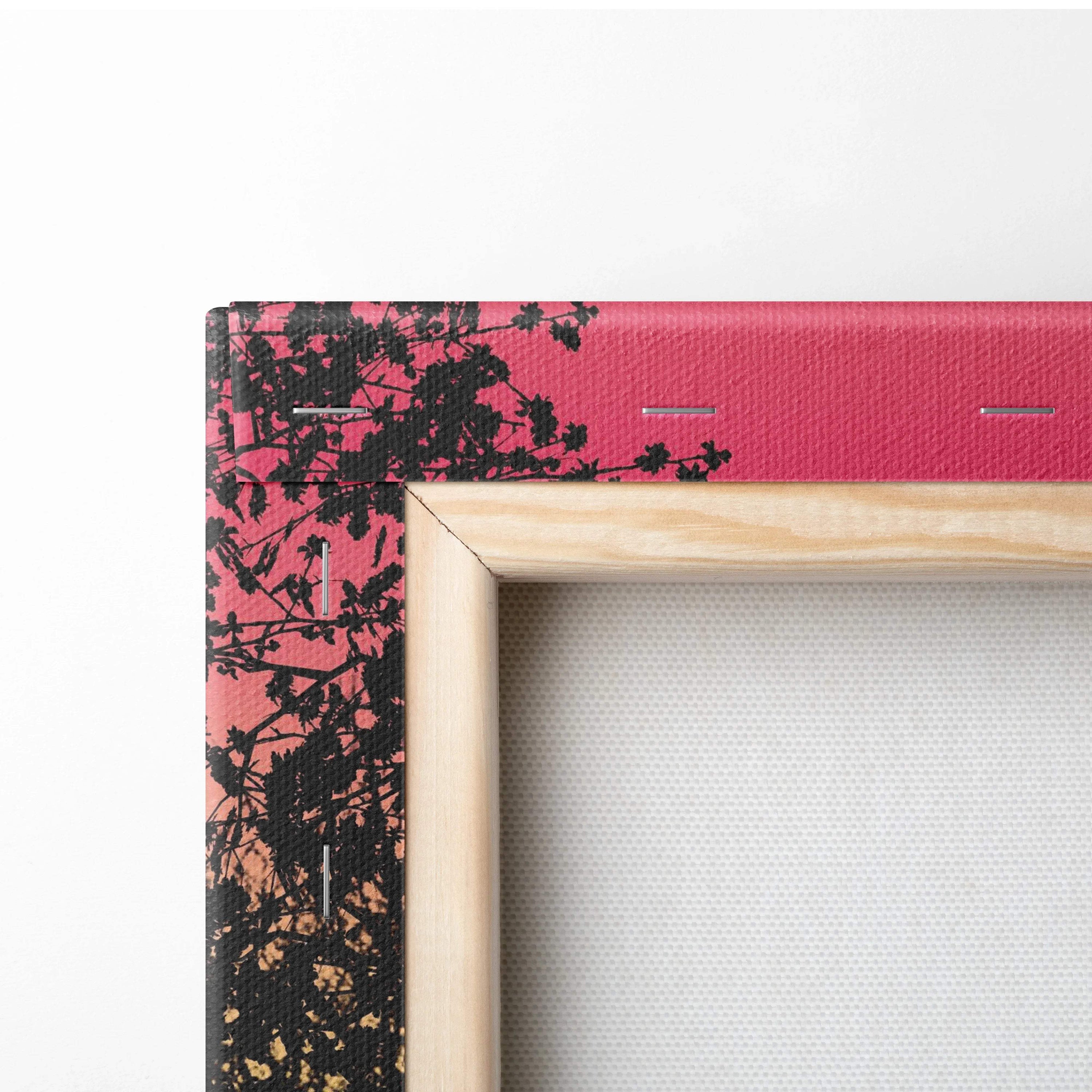 Vibrant pink canvas frame with black botanical print and light wood trim