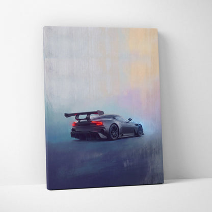 Aston Martin Vulcan inspired canvas art featuring a sleek dark gray sports car with a rear spoiler and glowing taillights