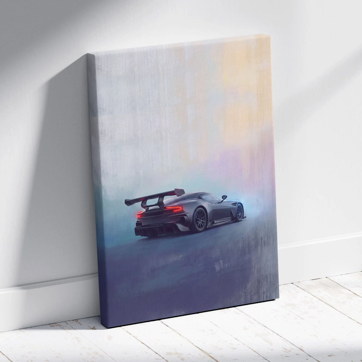 Aston Martin Vulcan inspired premium canvas wall art featuring a sleek dark gray sports car with rear spoiler and glowing taillights