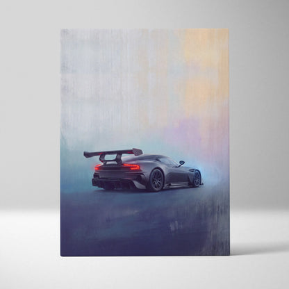 A sleek matte black aston martin vulcan inspired sports car with a rear wing and glowing red taillights on canvas art