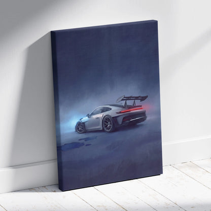 A sleek silver Porsche 911 GT3 RS canvas print of the rear view with glowing taillights and wing in a moody blue mist