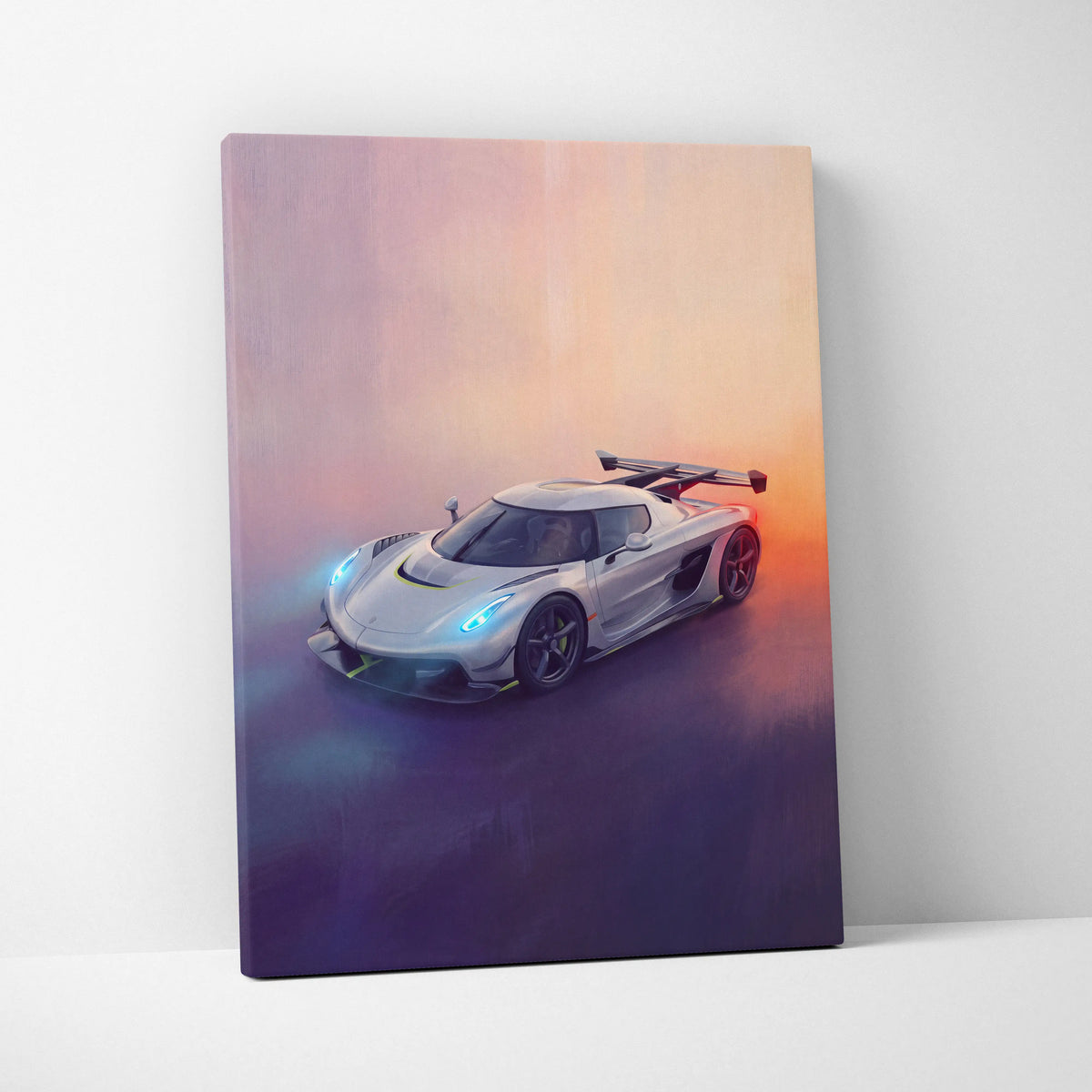 A sleek silver Koenigsegg Jesko hypercar canvas art with glowing blue headlights and vibrant sunset backdrop