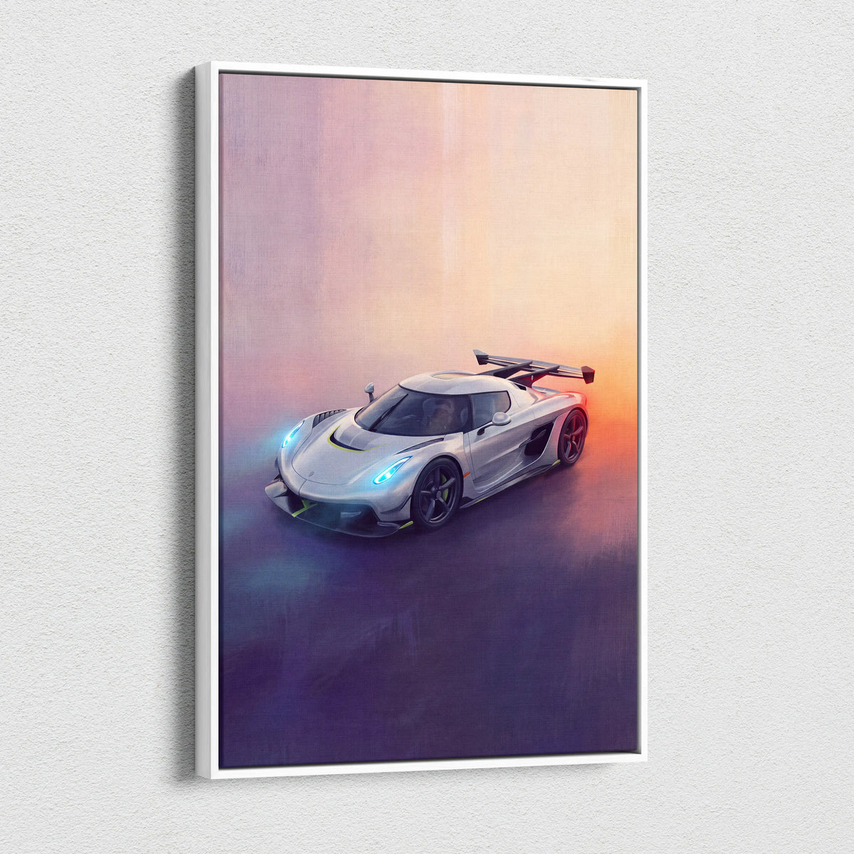 White-framed canvas print featuring a sleek silver koenigsegg jesko hypercar with glowing blue headlights and black accents