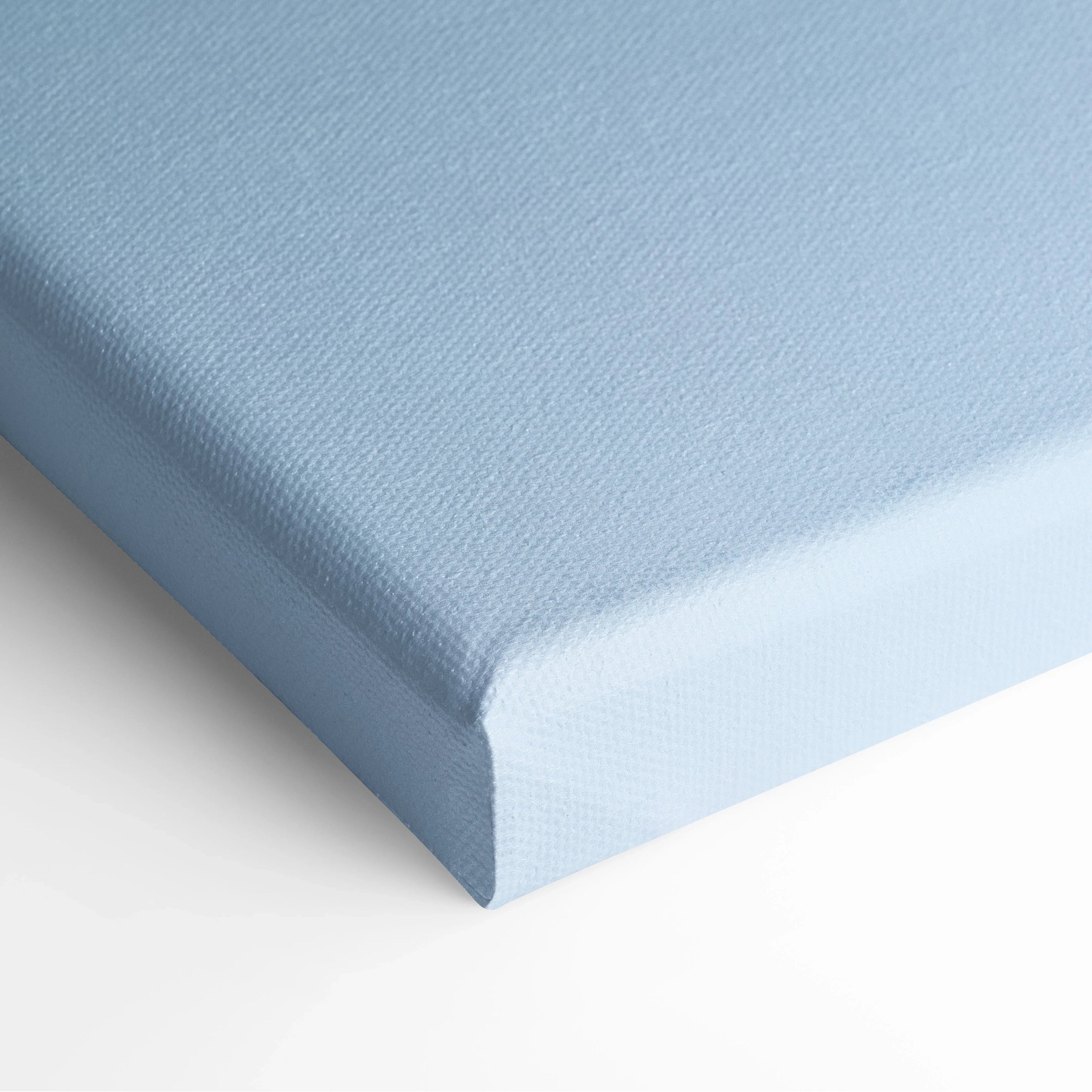 Light blue canvas art print with subtle textured abstract design wrapped around edges.