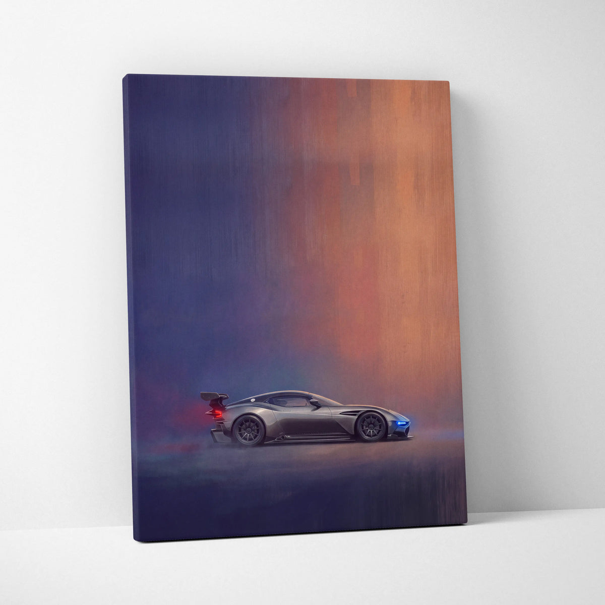 A sleek silver Aston Martin Vulcan inspired racing car on a canvas with dramatic gradient lighting track edition print