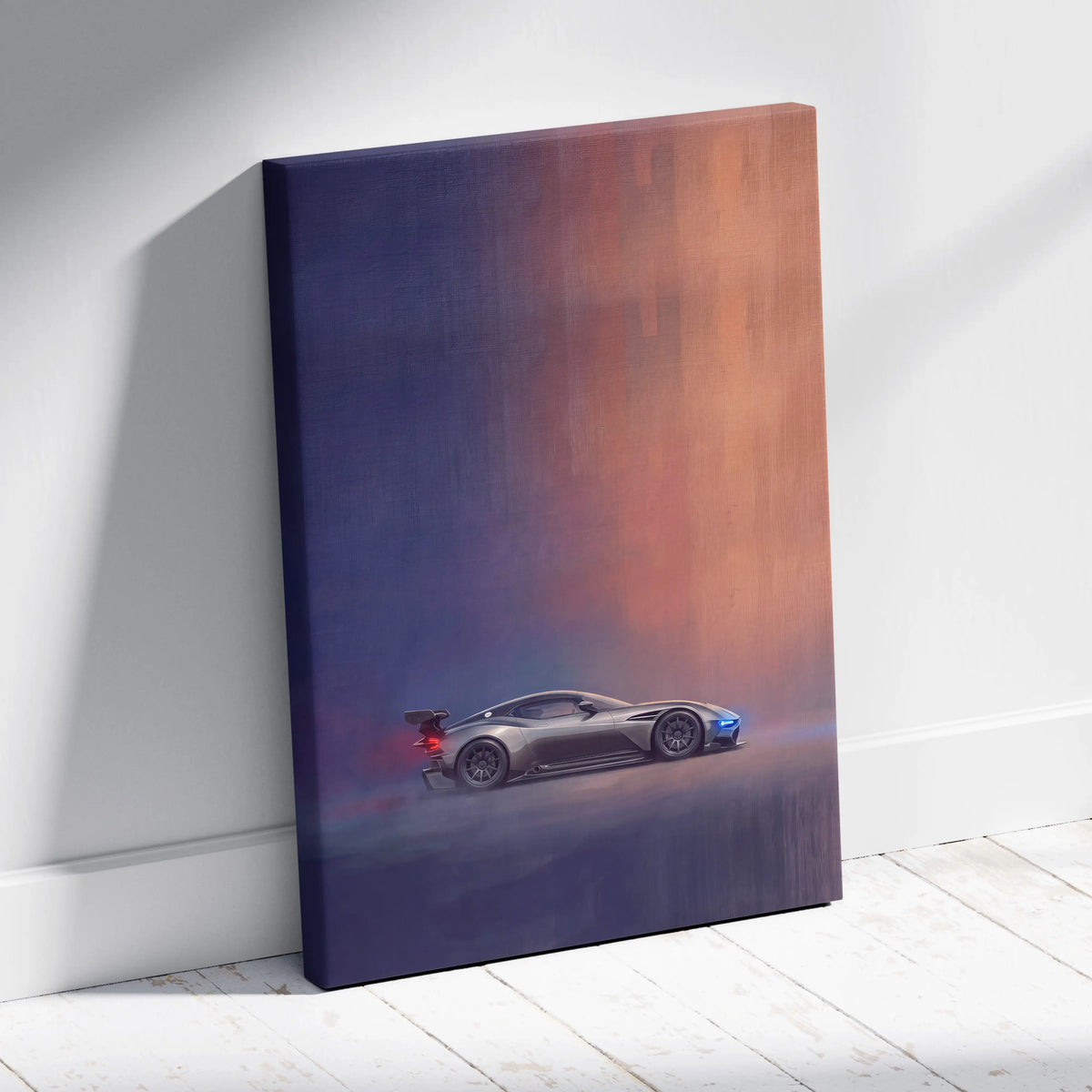 Aston Martin Vulcan inspired sleek silver sports car canvas print in motion on a deep blue to orange gradient background