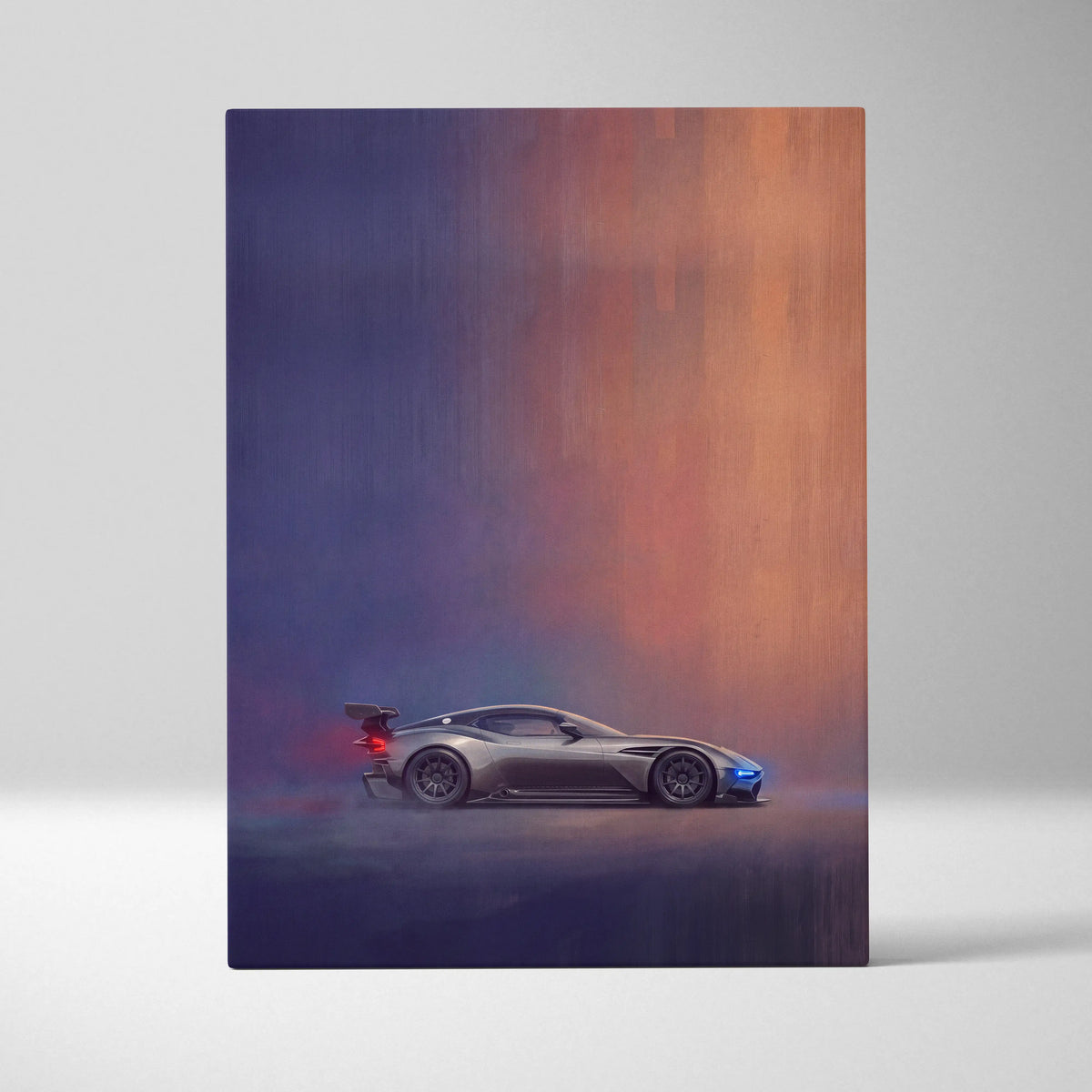 A sleek silver aston martin valkyrie race car with blue and red accents on a canvas painting print wall art