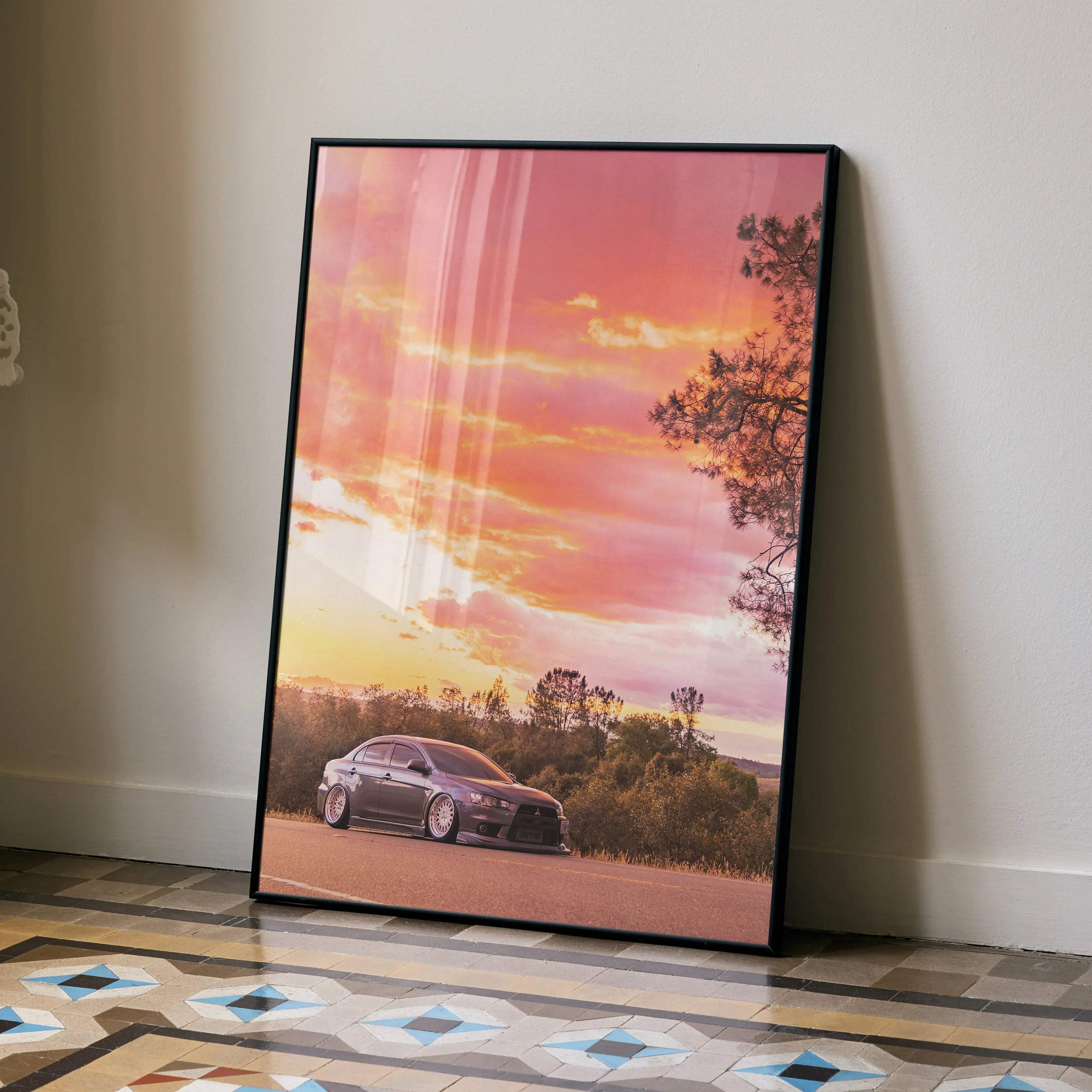 Mitsubishi Evo X at sunset with pink sky and trees poster wall art in black frame.