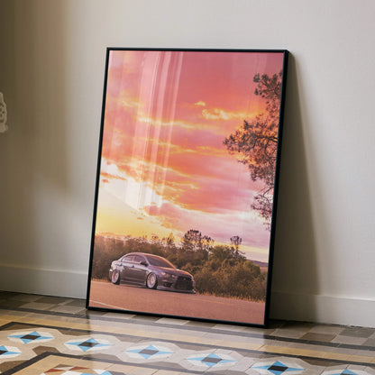 Mitsubishi Evo X at sunset with pink sky and trees poster wall art in black frame.