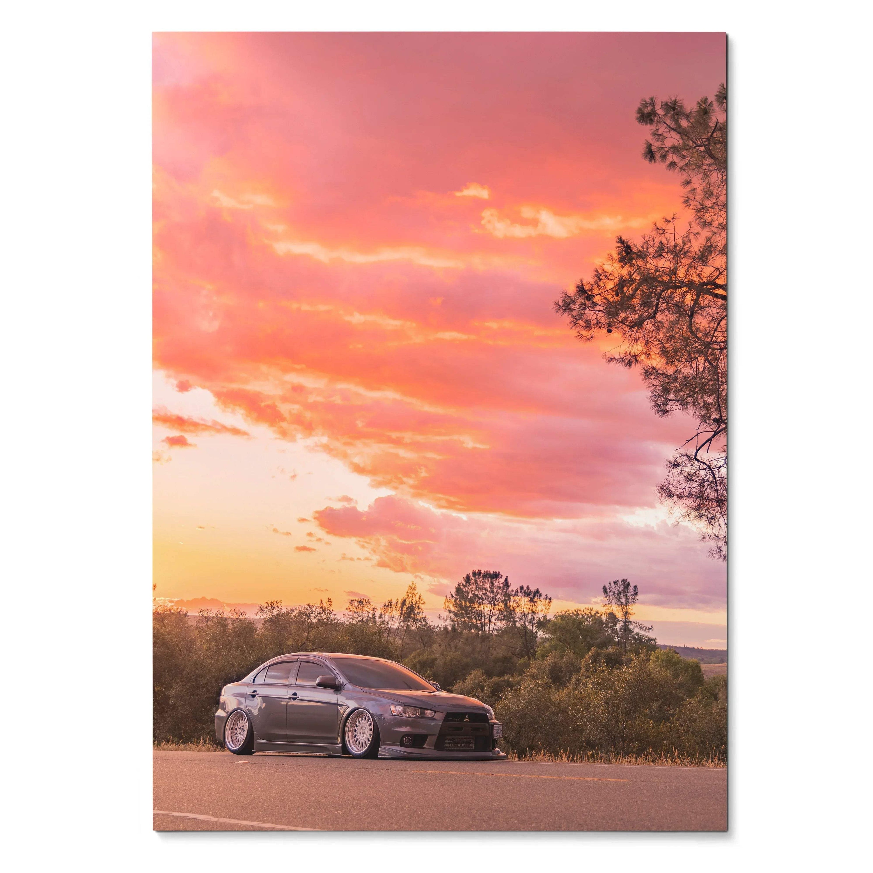 Mitsubishi Evo X poster with sunset sky and silhouette trees, automotive wall art print.