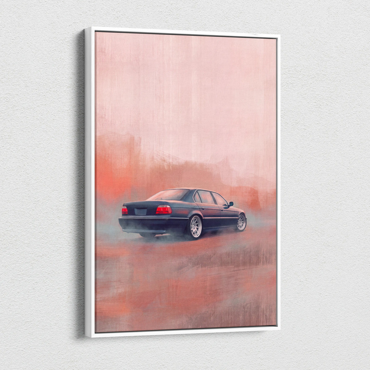 A framed canvas print of a dark blue bmw 5 series sedan drifting on a misty pink road for office wall art