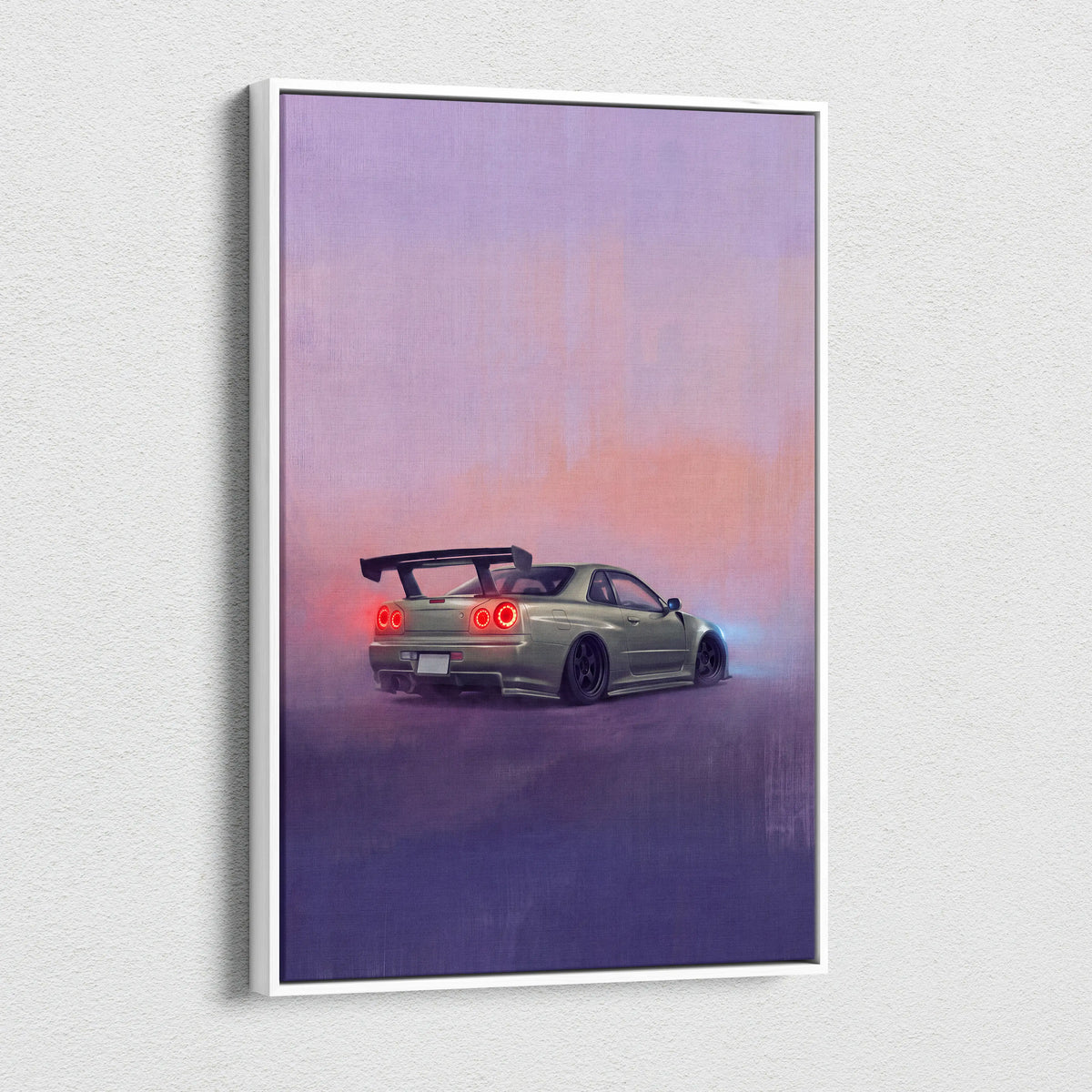 A framed canvas print of a matte olive-green Nissan Skyline R34 with glowing red taillights against a purple-pink twilight sky