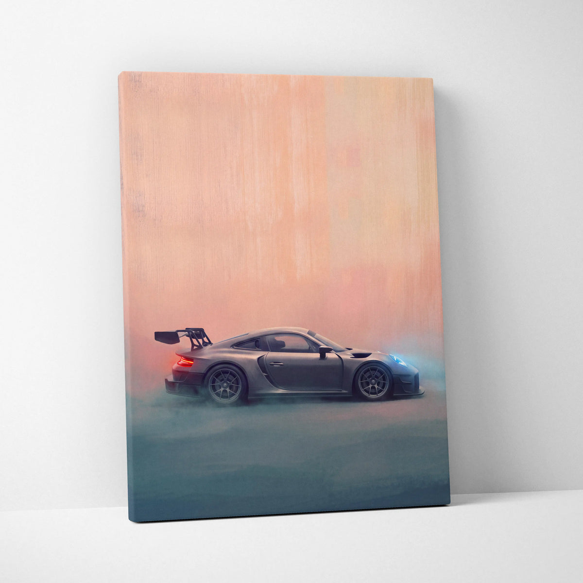 A matte-finish canvas print featuring a dark gray Porsche 911 GT3 RS with black stripes and an aerodynamic rear wing