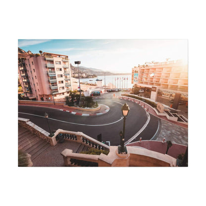 Canvas wall art depicting the Monaco F1 track hairpin turn with surrounding buildings and warm lighting.