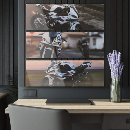 BMW S1000RR three-piece acrylic canvas art mounted as horizontal wall art above desk with lavender vase.