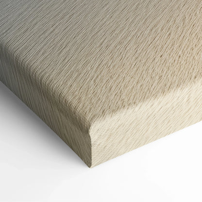 Close-up of wrapped canvas wall art with textured beige and light tan sandy wave pattern.