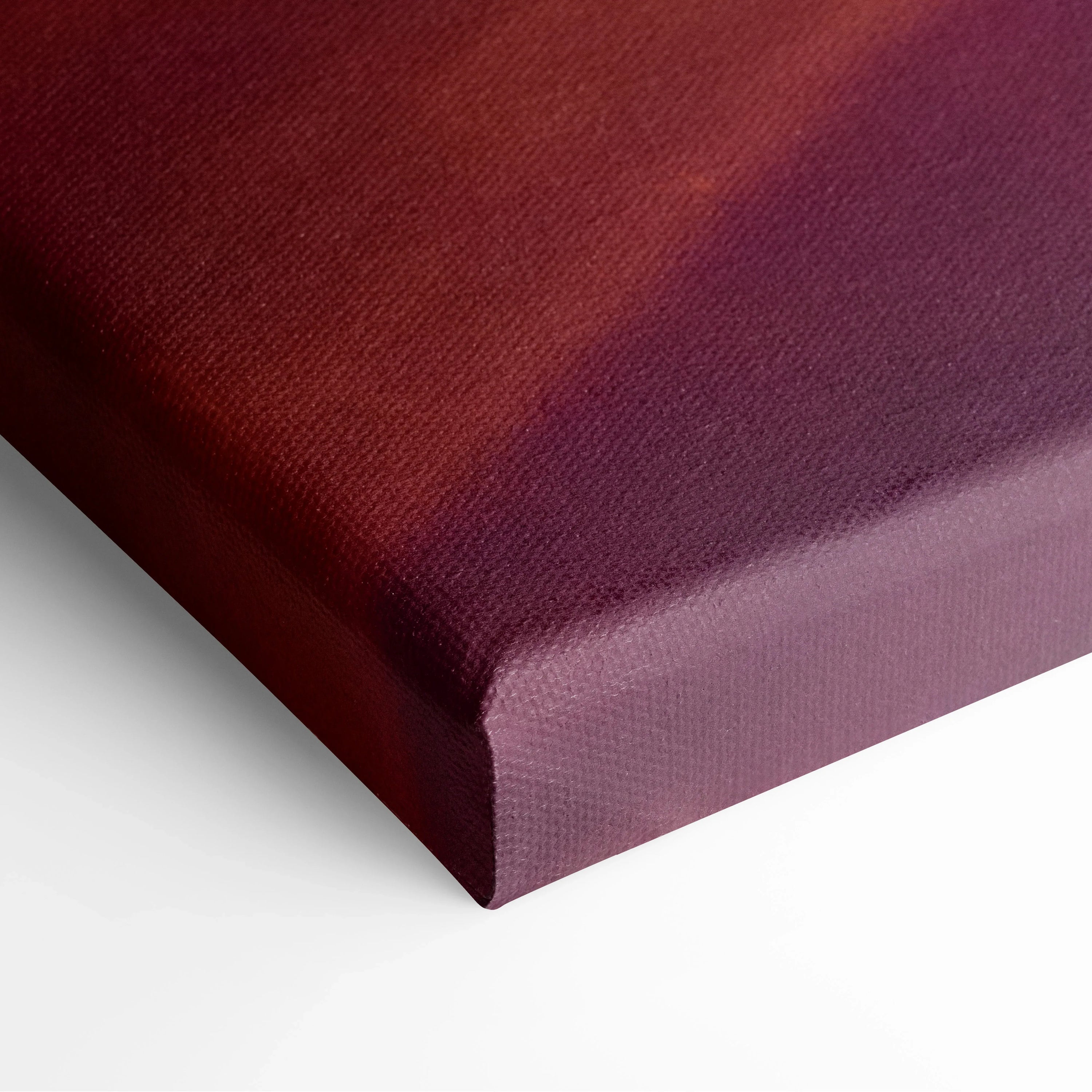 Corner of a deep red and purple abstract canvas art with textured fabric surface and stretched edges.