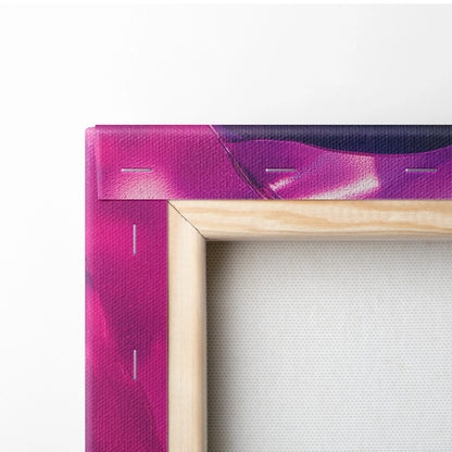 Close-up of wooden frame corner with stretched vibrant purple and pink abstract canvas art.