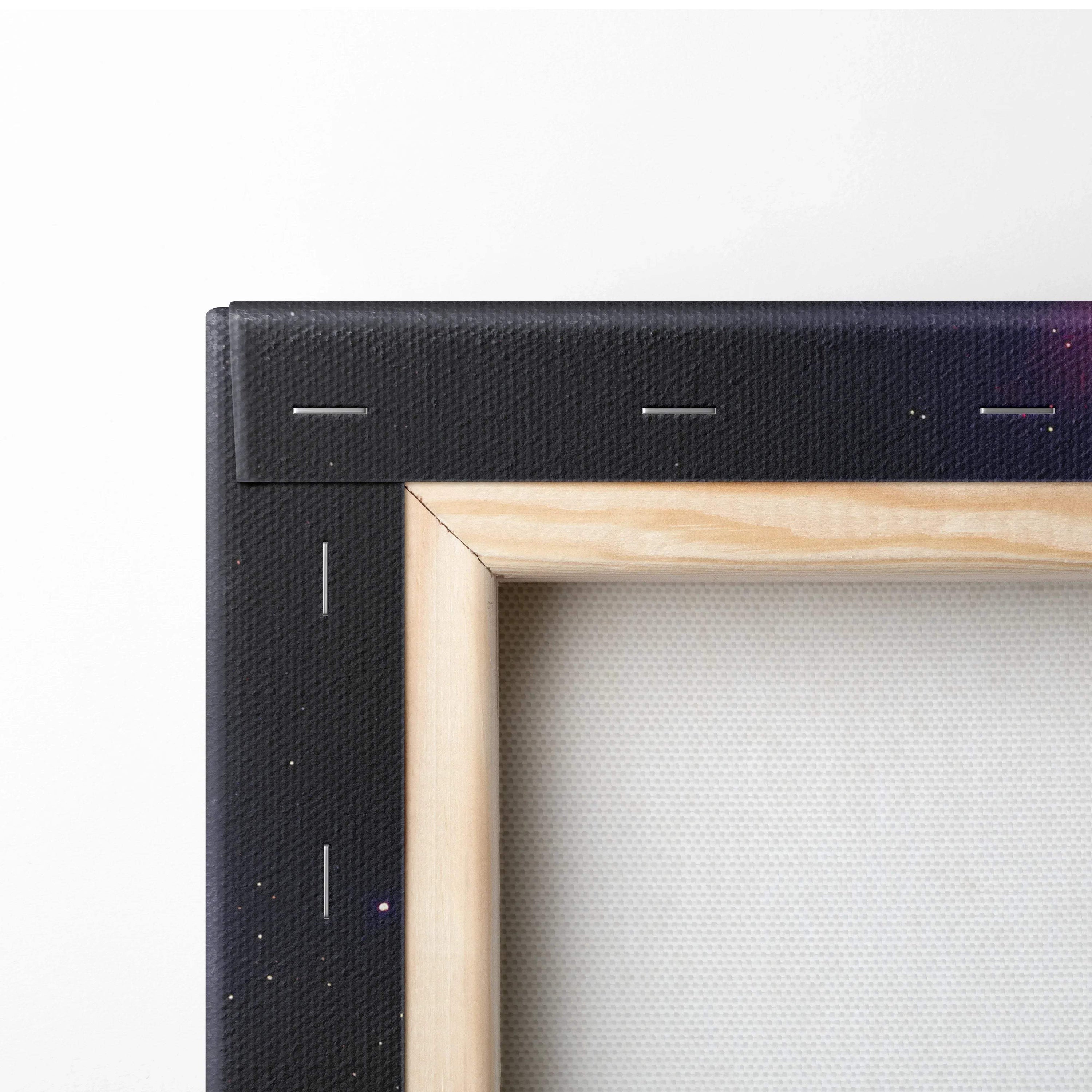 Corner of a wooden frame canvas wall art with black outer edge and white stretched fabric canvas surface.