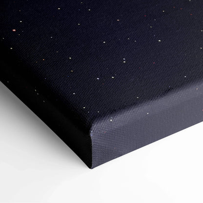 Black canvas art wall art with a subtle pattern of small white and gold speckles.