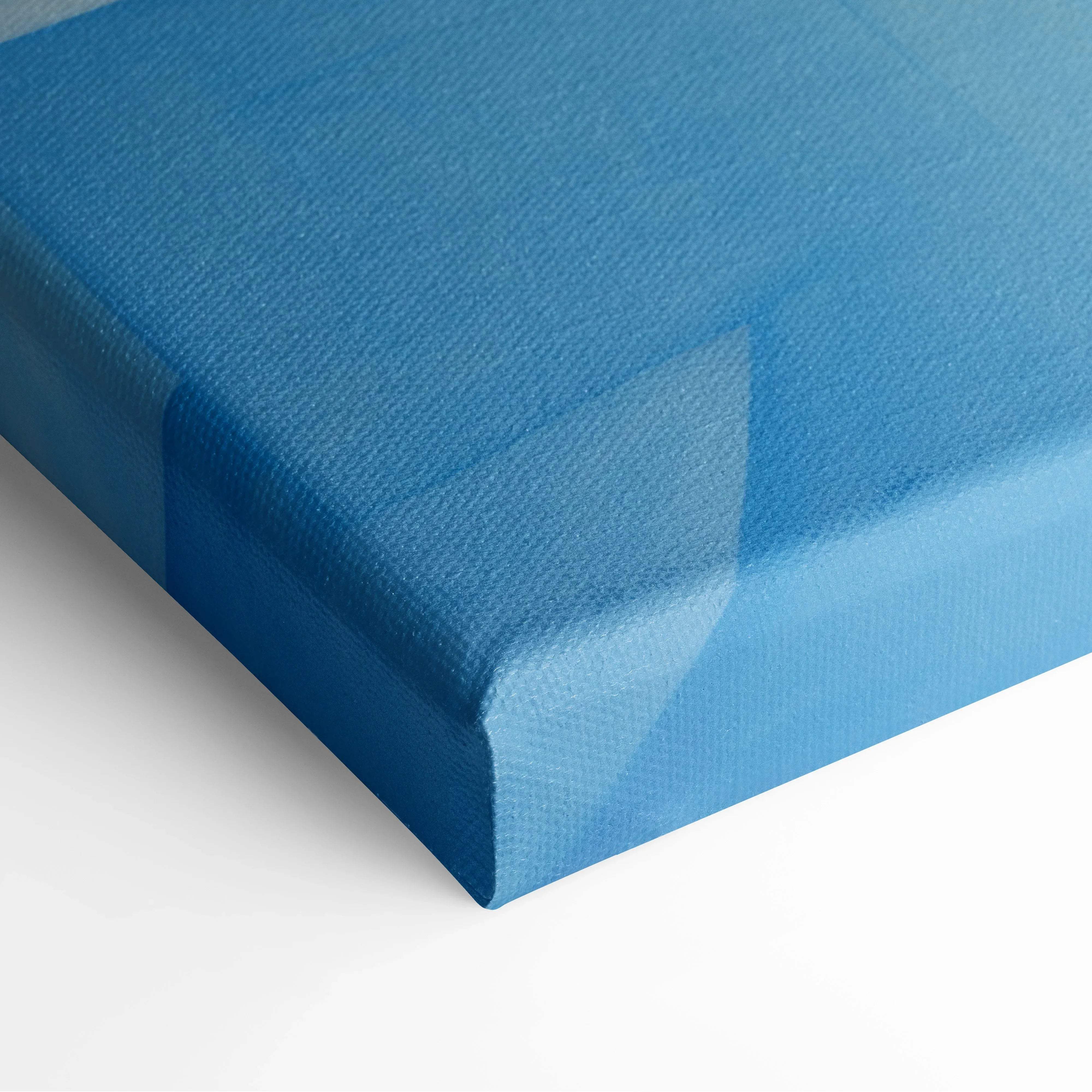 Blue canvas print with textured surface and subtle gradient for abstract cityscape wall art with colorful blues and oranges