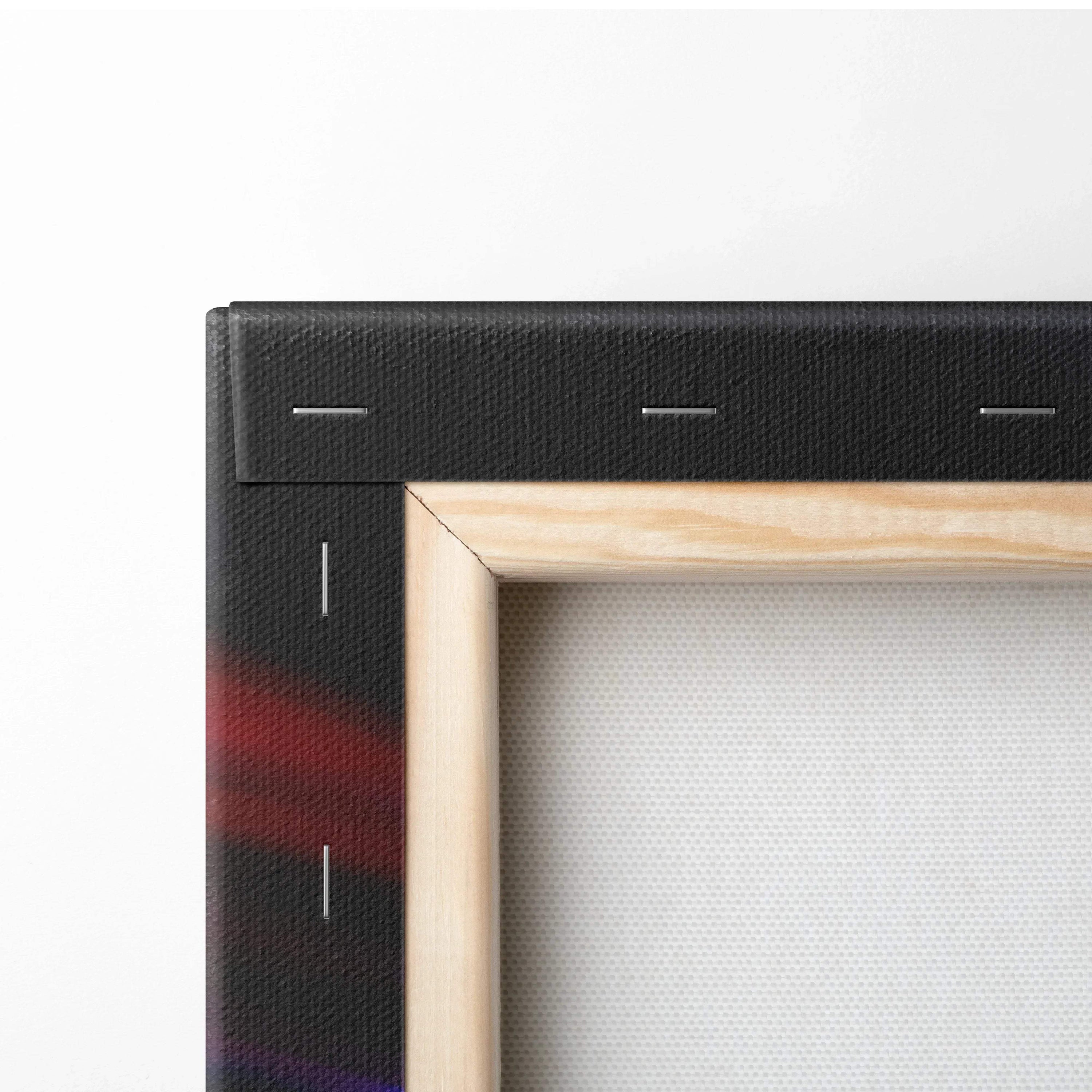 Close-up of stretched canvas art with natural wood frame and black fabric edges with subtle red shading.