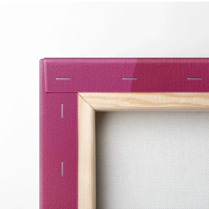 Close-up of natural wood frame stretched with vibrant purple canvas, showcasing detailed staples and texture.