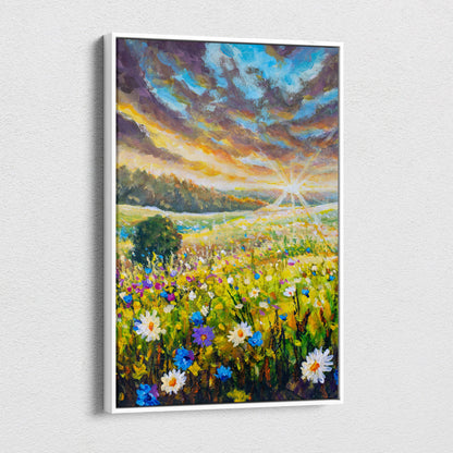 A vibrant wildflower meadow painting style wall art in a white frame featuring colorful blooms under a dramatic sky