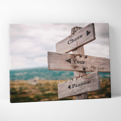 Weathered wooden signpost wall art print with three grayish brown directional signs reading chase your passion