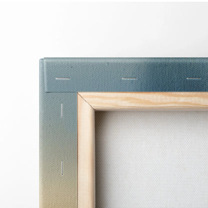 Close-up of wooden stretcher frame with watercolor gradient canvas for wall art.