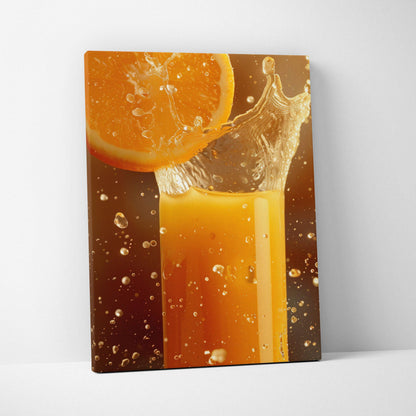 Canvas wall art featuring vibrant orange slice splashing into glass of orange juice with water droplets.
