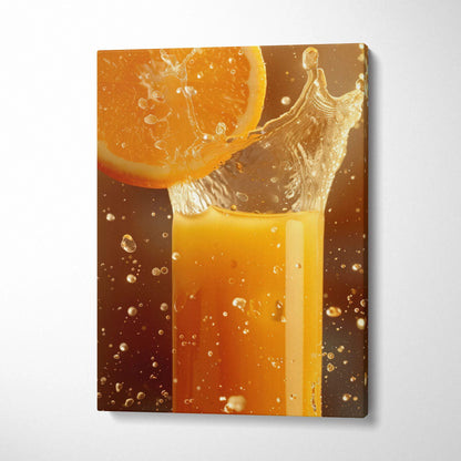 Canvas wall art of a fresh orange slice splashing into a glass of juice with water droplets.