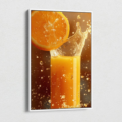 Canvas wall art featuring vibrant orange slice splashing into glass of orange juice.