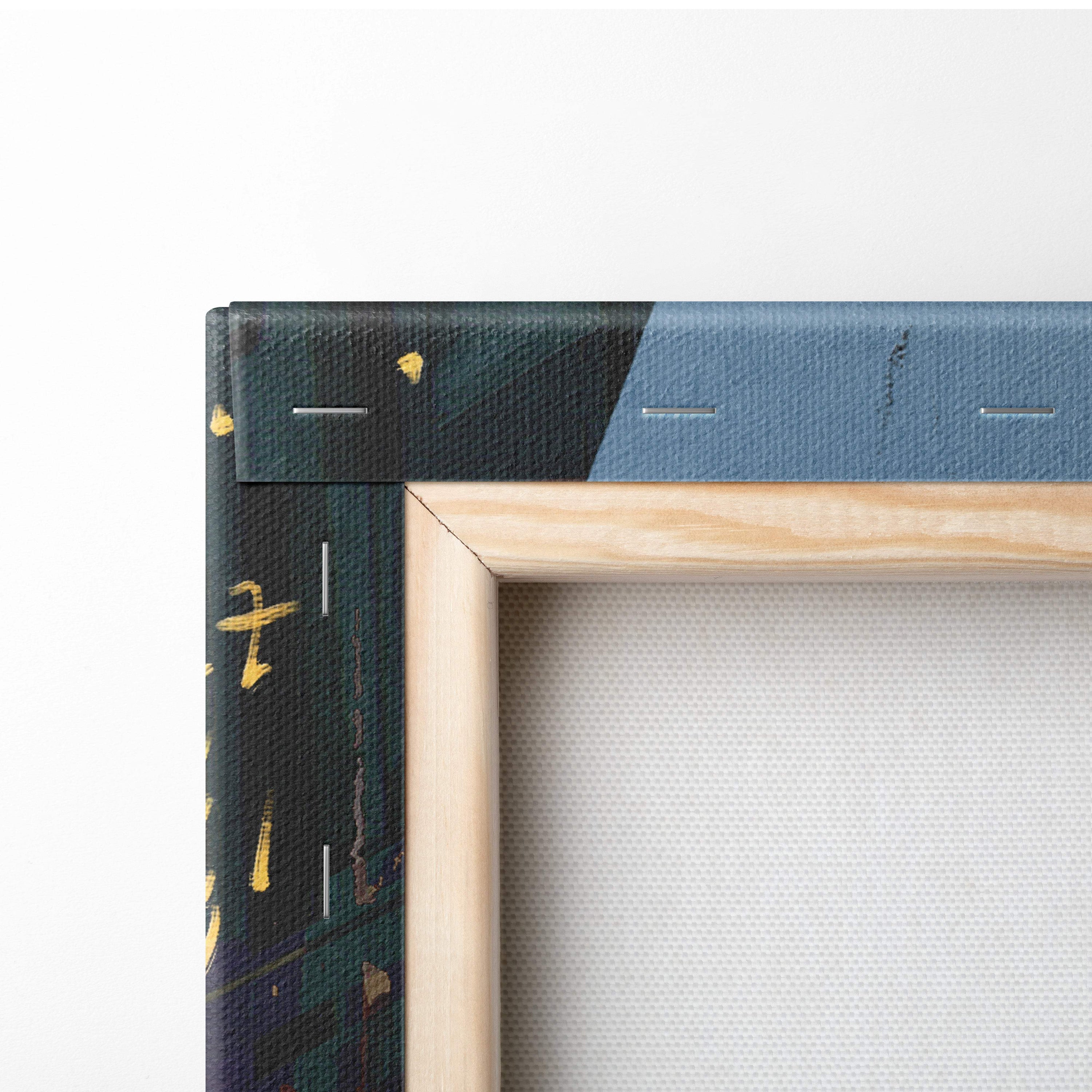 A framed canvas painting of abstract city lights with dark green blue design and gold splatters in a light wood frame