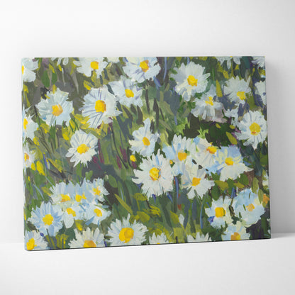 A rectangular canvas print of white daisy flowers with yellow centers in impressionist style green floral meadow decor
