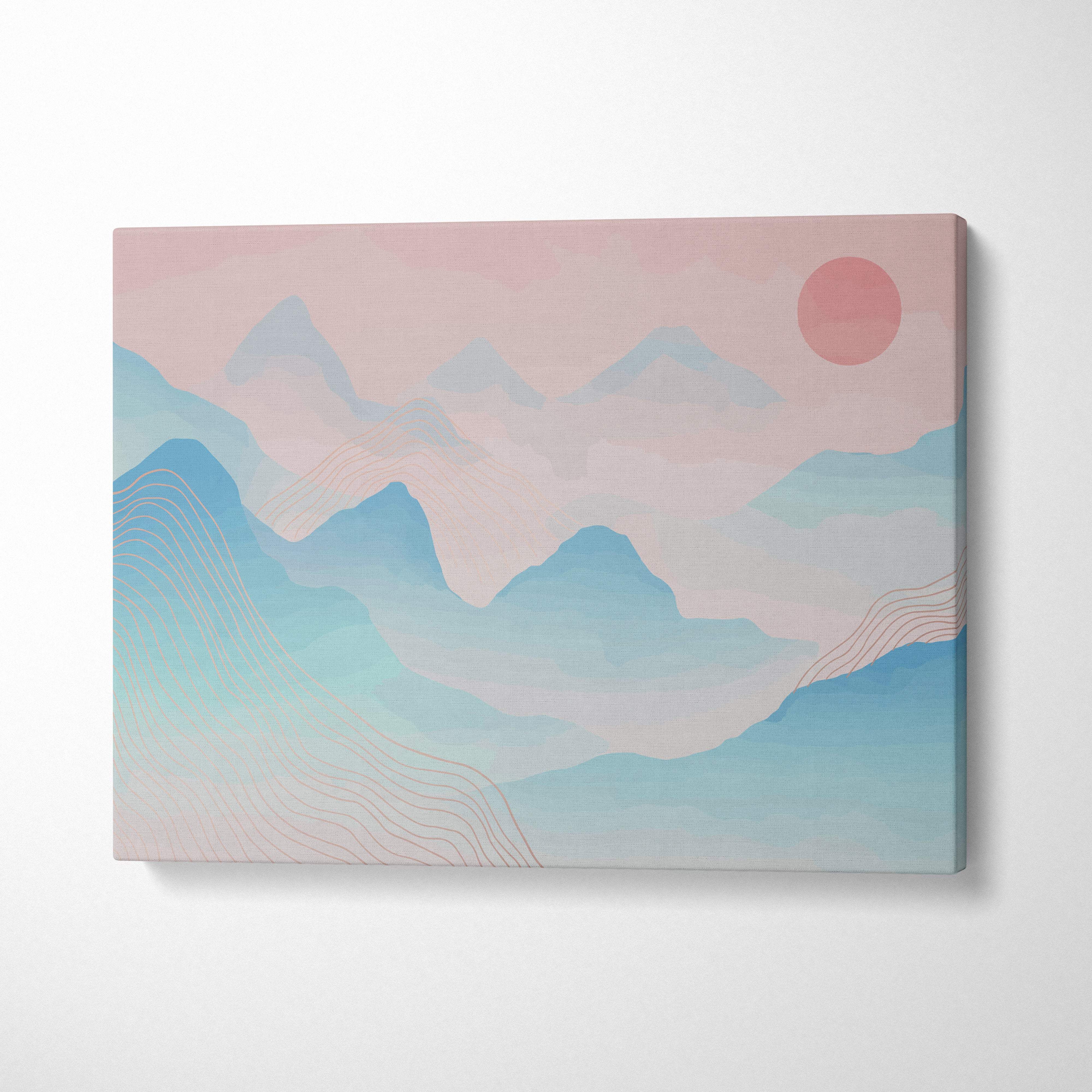 Pastel mountain landscape canvas wall art with layered blue and pink hues and a warm pink sun in minimalist frame