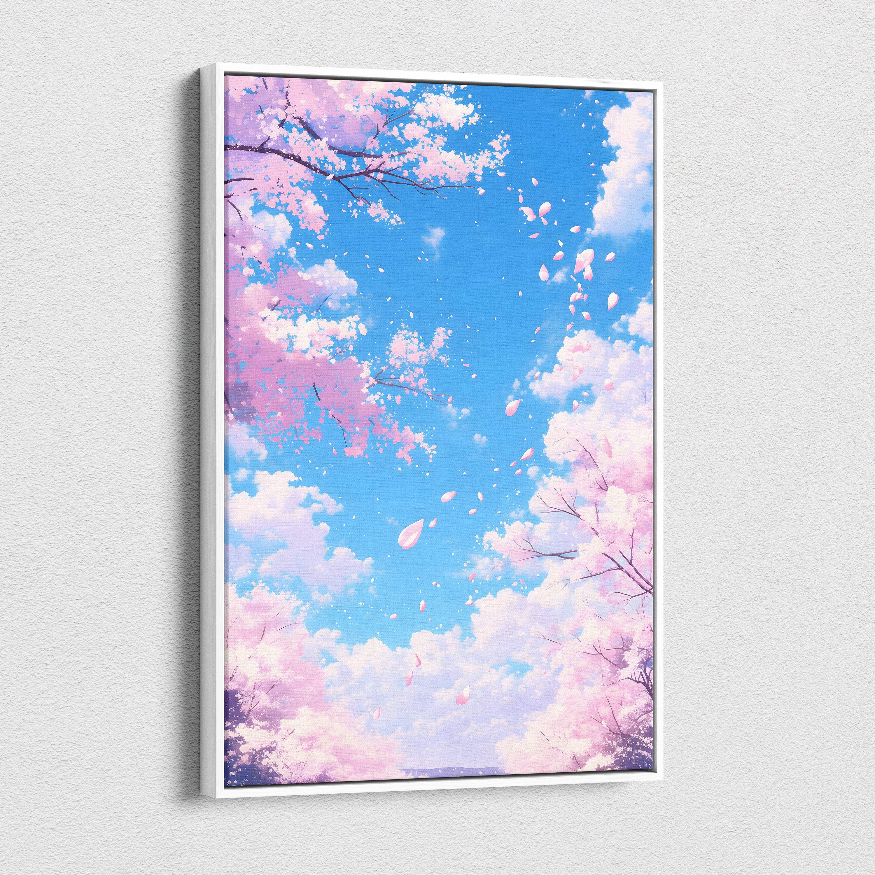 A framed digital art print of pink cherry blossoms falling against a vibrant blue sky with fluffy white clouds