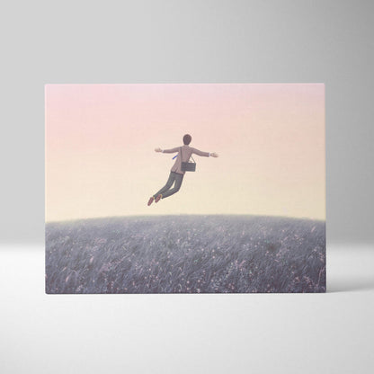 A rectangular canvas print of a floating man holding a black briefcase above a pastel dreamscape field