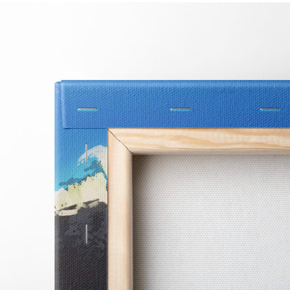 Blue textured canvas wall art with abstract turquoise ocean waves and light wood frame for coastal decor