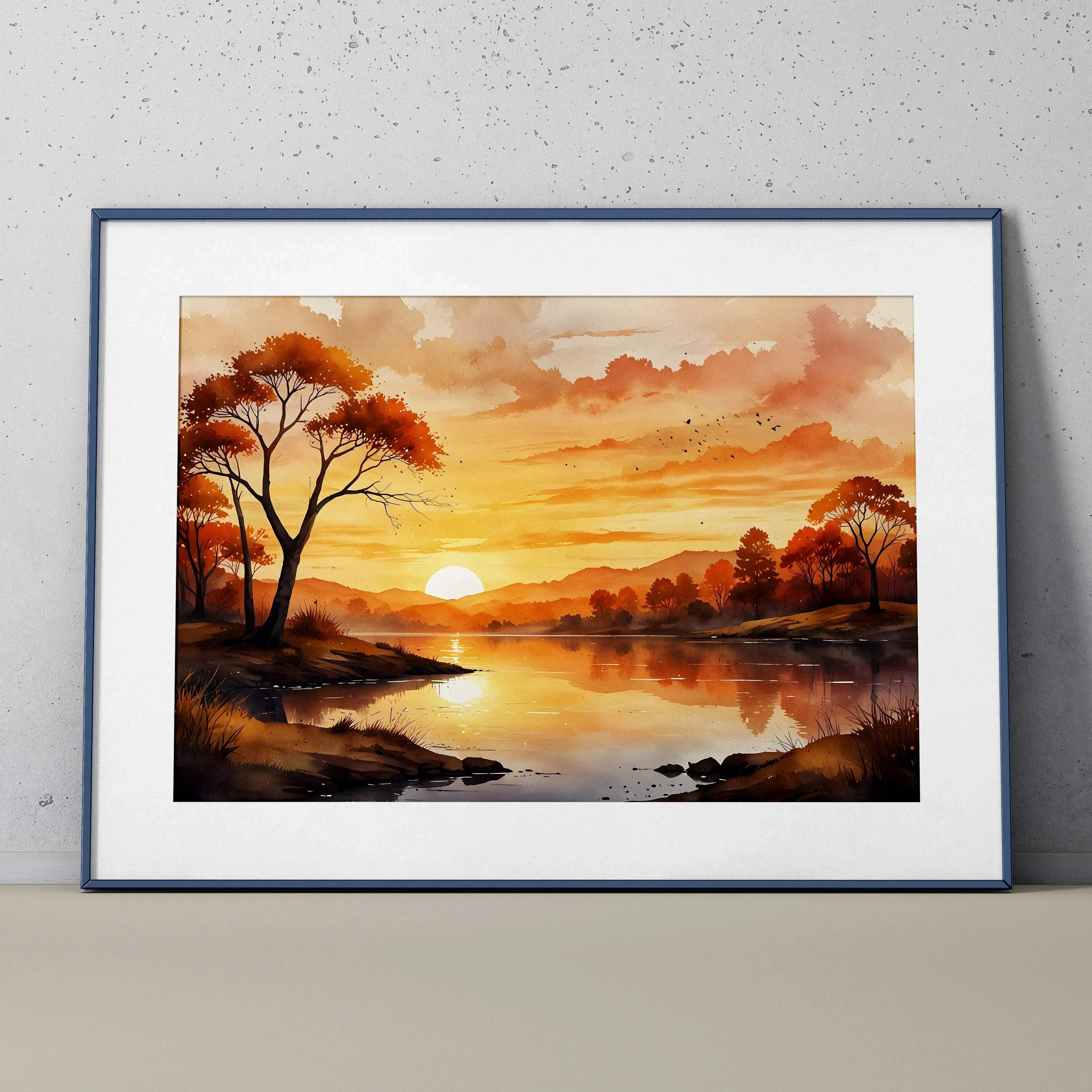 Watercolor sunset poster with orange sky, trees, and reflective river, framed wall art.